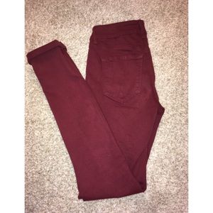 Maroon jeans.